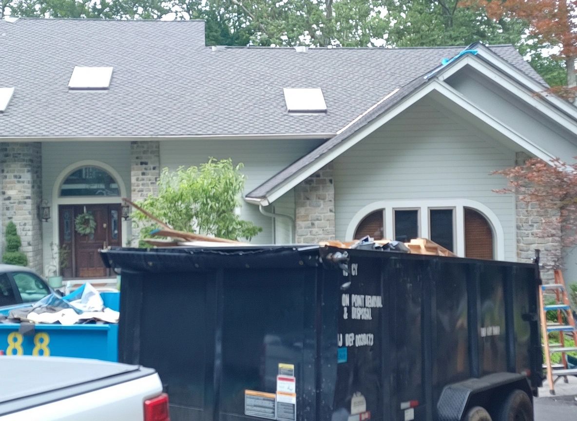 20 Yard Dump Trailer Rental | Mr. Dumpster | Bergen & Passaic County NJ 20 yard dump trailer rental Bergen County NJ — Mr. Dumpster driveway-safe dump trailer loaded with roofing debris at a residential home in Passaic County New Jersey